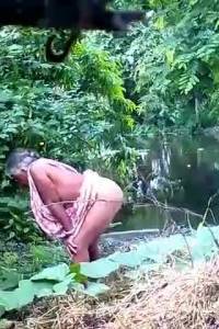 Click to play video Indian granny Standing poop - video 17